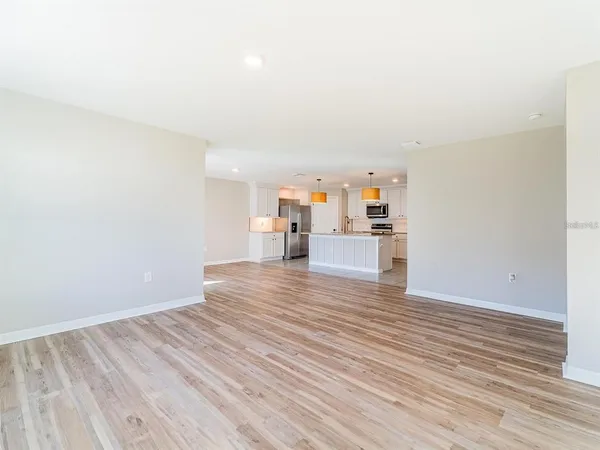 a room with wooden floor and furniture