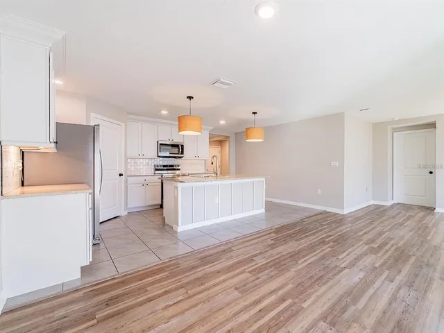 a view of kitchen with wooden floor