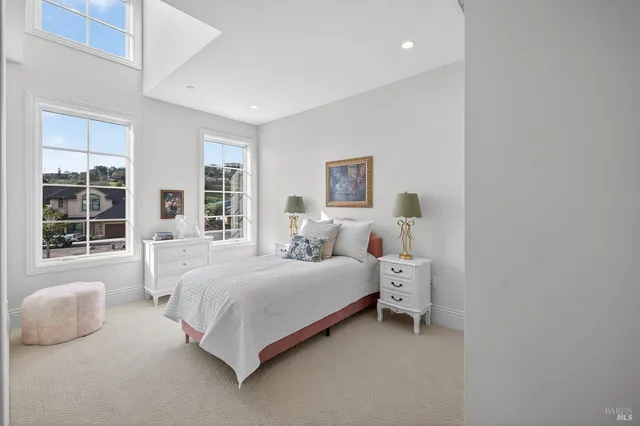 a room with white cabinets and sink
