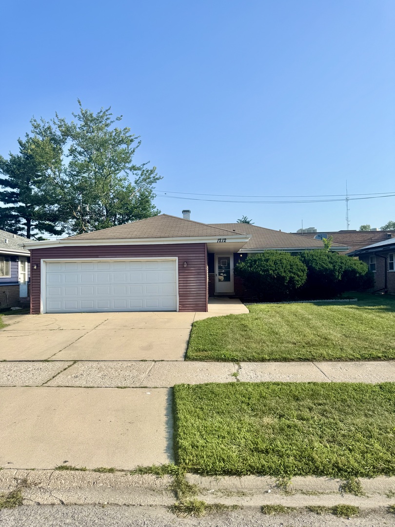 1212 East 151st Street Dolton, IL 60419 - Photo 24 of 24 a front view of a house with a yard and garage