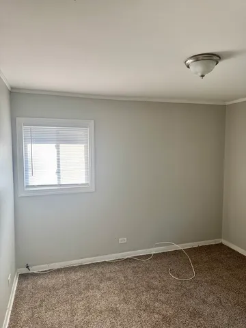 a view of an empty room and closet area