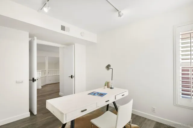 a view of a room that has a table and a table in it