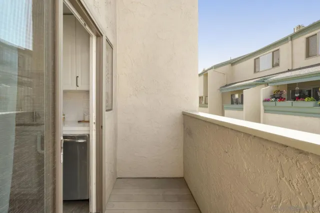 a view of balcony and kitchen