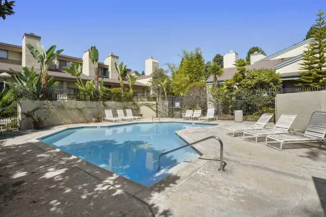 a view of a swimming pool with a patio