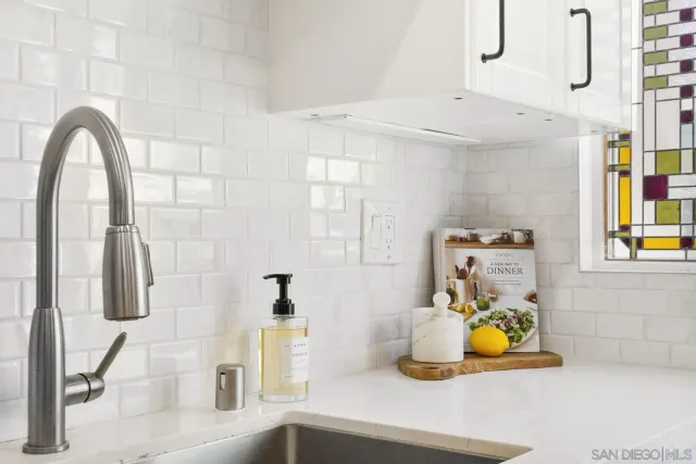 a bathroom with a sink and a window