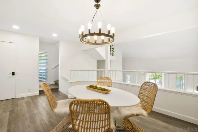 a dining room with furniture and a window