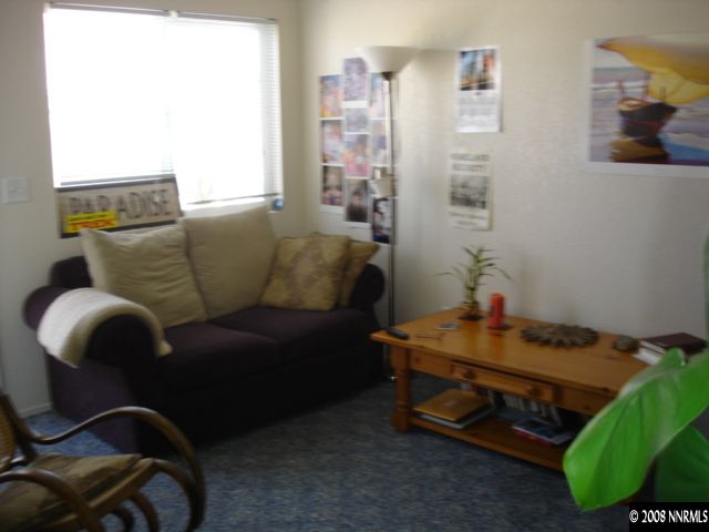 627 Roberts Street Reno, NV 89502 - Photo 3 of 5 a living room with furniture and a window