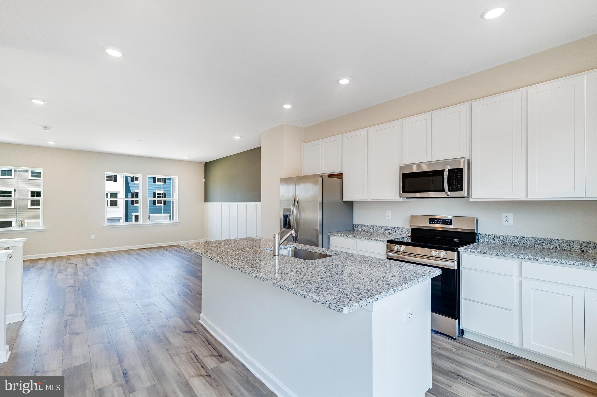 68 Gray Silver Road Inwood, WV 25428 - Photo 5 of 28 a kitchen with granite countertop stainless steel appliances refrigerator sink and microwave
