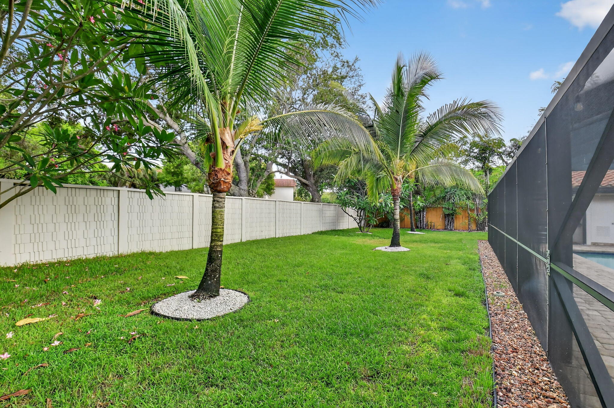 360 Northwest 53rd Street Boca Raton, FL 33487 - Photo 15 of 72 a view of a garden with a tree