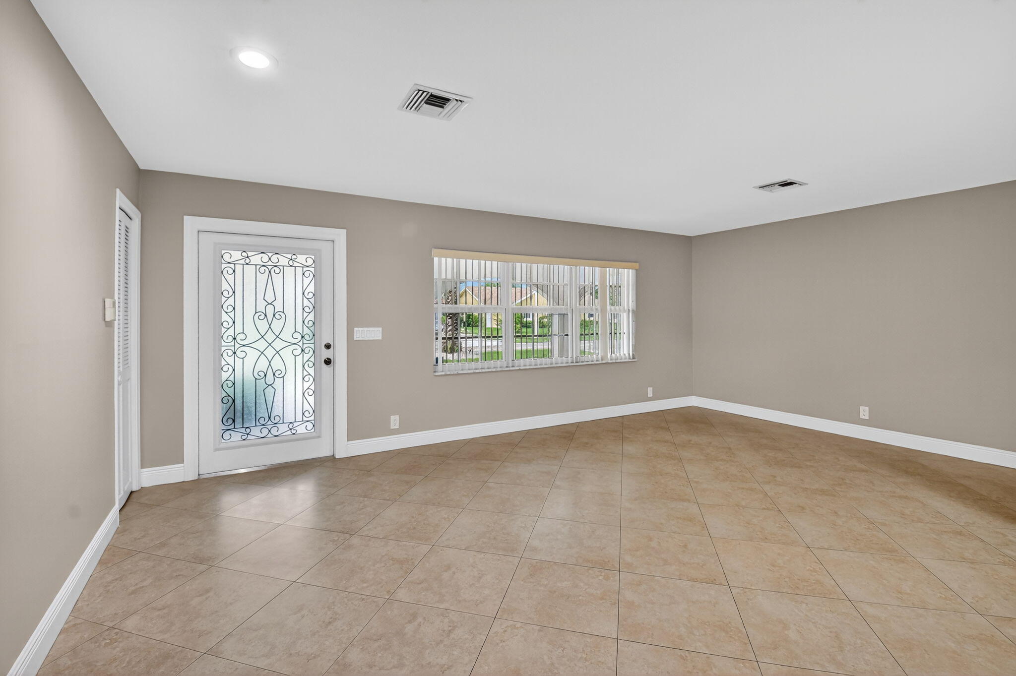 360 Northwest 53rd Street Boca Raton, FL 33487 - Photo 17 of 72 a view of an empty room with a window