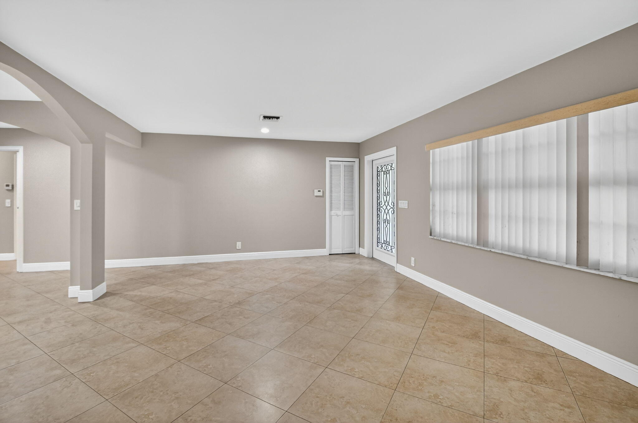 360 Northwest 53rd Street Boca Raton, FL 33487 - Photo 20 of 72 a view of an empty room with a window