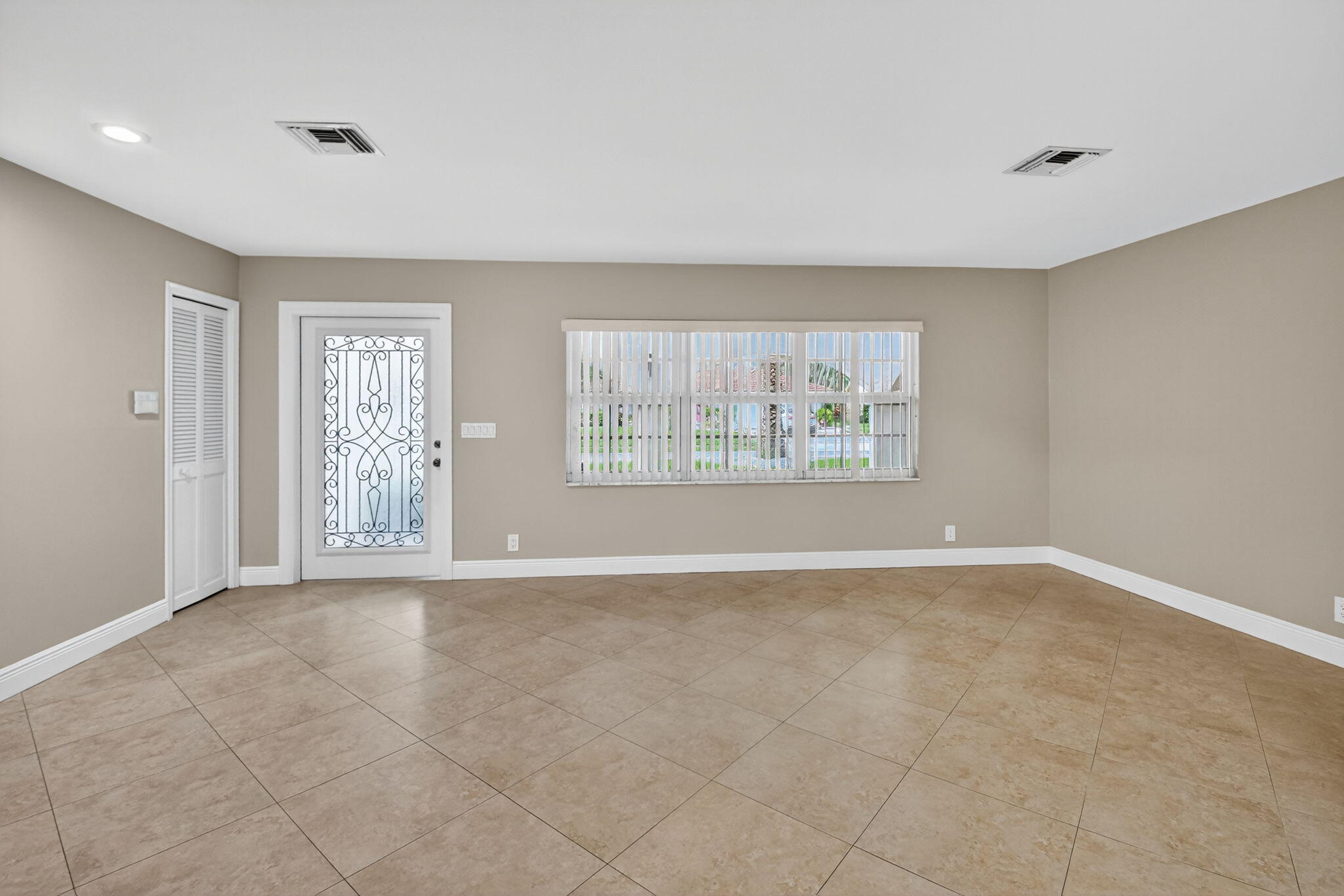360 Northwest 53rd Street Boca Raton, FL 33487 - Photo 21 of 72 a view of an empty room with a window