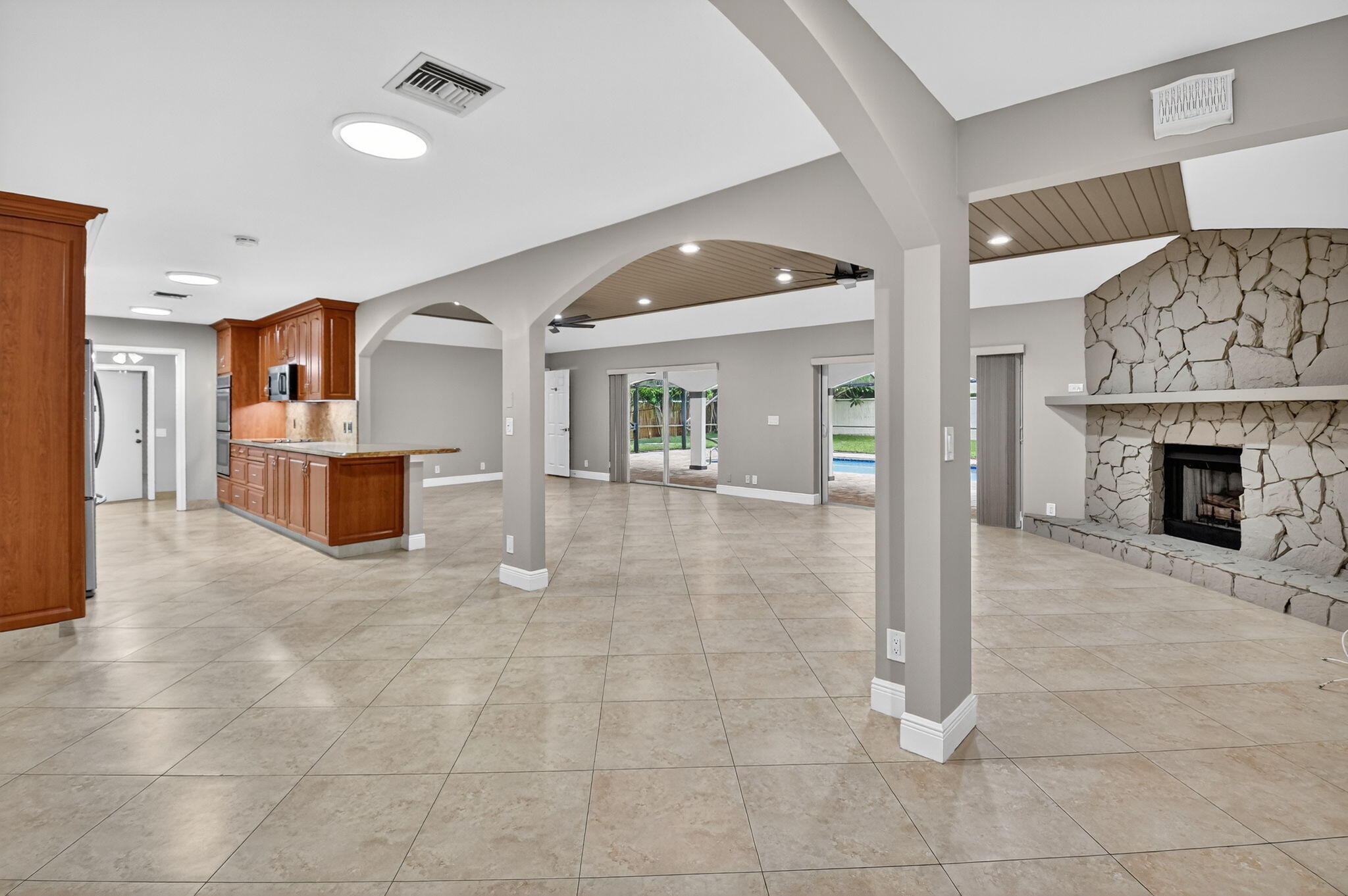 360 Northwest 53rd Street Boca Raton, FL 33487 - Photo 23 of 72 a view of a livingroom with furniture and a fireplace