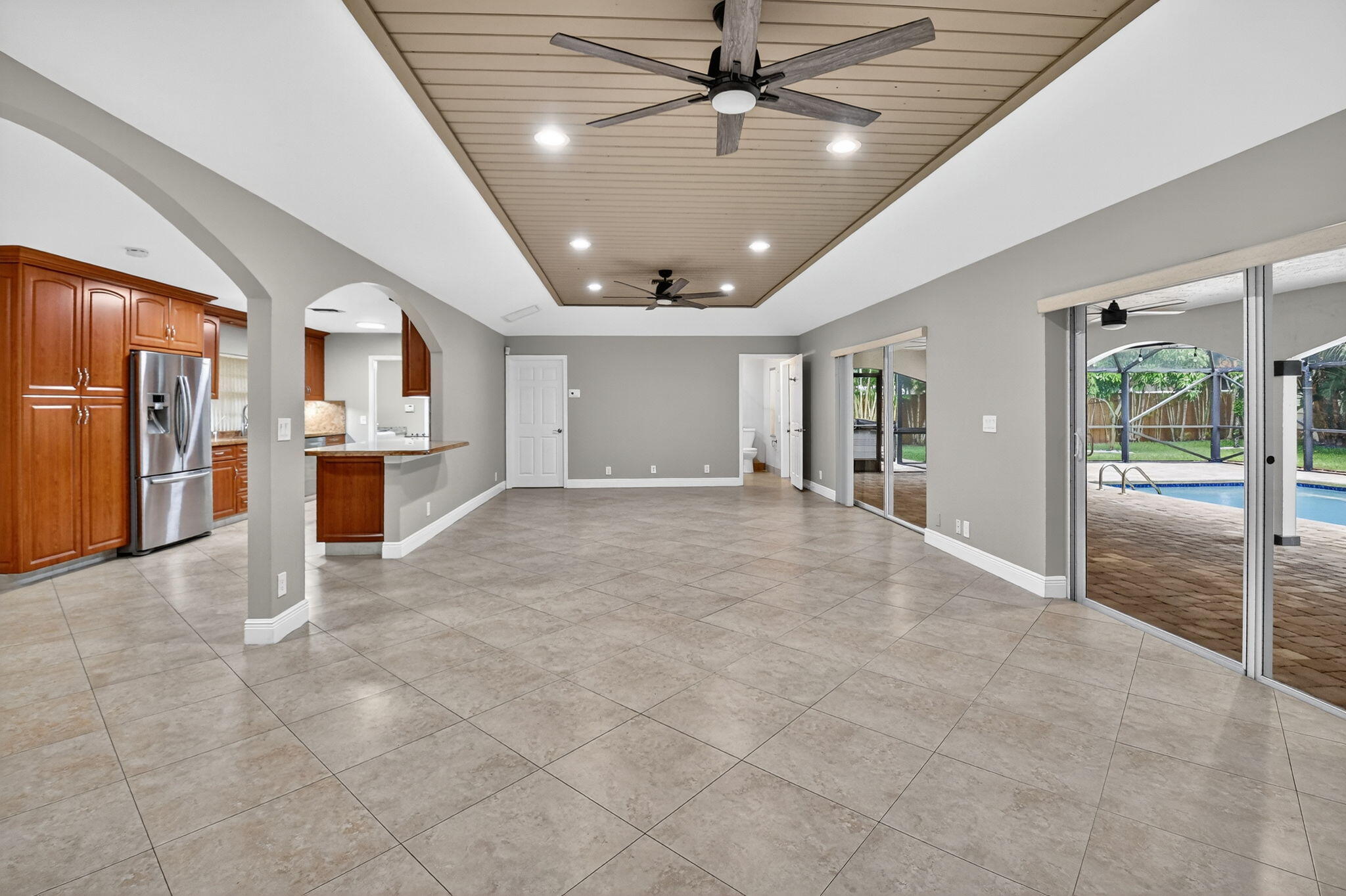 360 Northwest 53rd Street Boca Raton, FL 33487 - Photo 27 of 72 a view of a livingroom with furniture and a kitchen