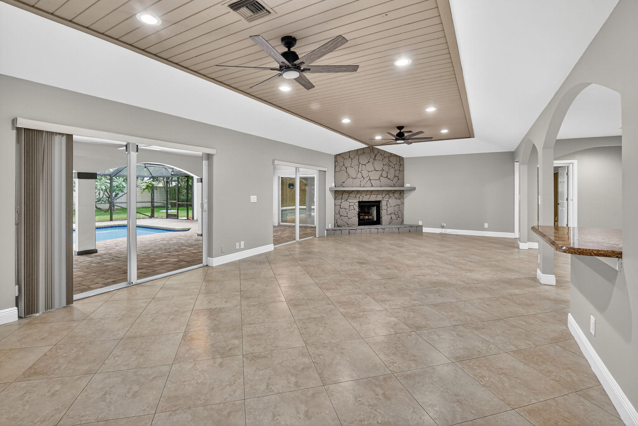 360 Northwest 53rd Street Boca Raton, FL 33487 - Photo 29 of 72 a view of an empty room with a fireplace and a window