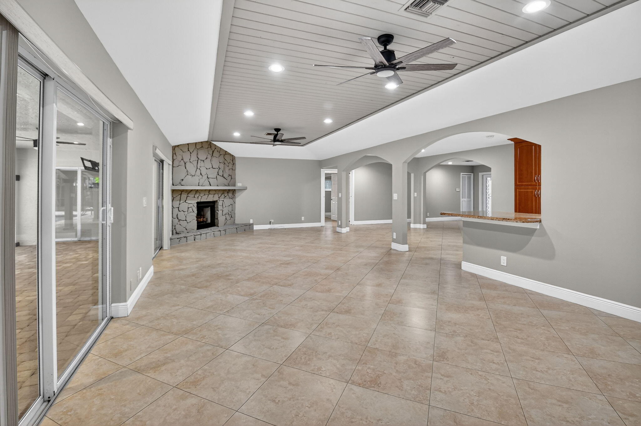 360 Northwest 53rd Street Boca Raton, FL 33487 - Photo 30 of 72 an empty room with chandelier fan and windows