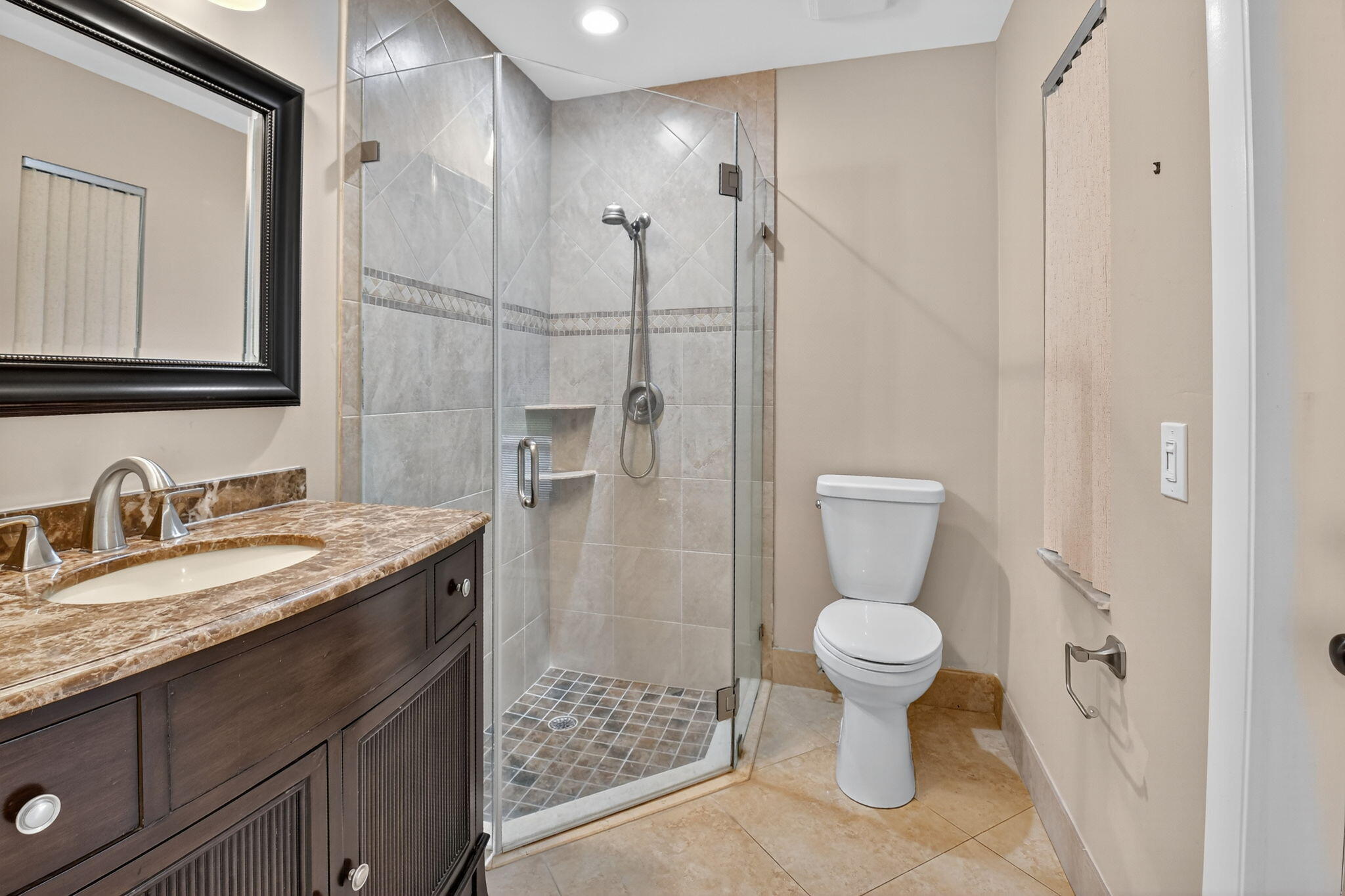 360 Northwest 53rd Street Boca Raton, FL 33487 - Photo 31 of 72 a bathroom with a granite countertop sink toilet and shower