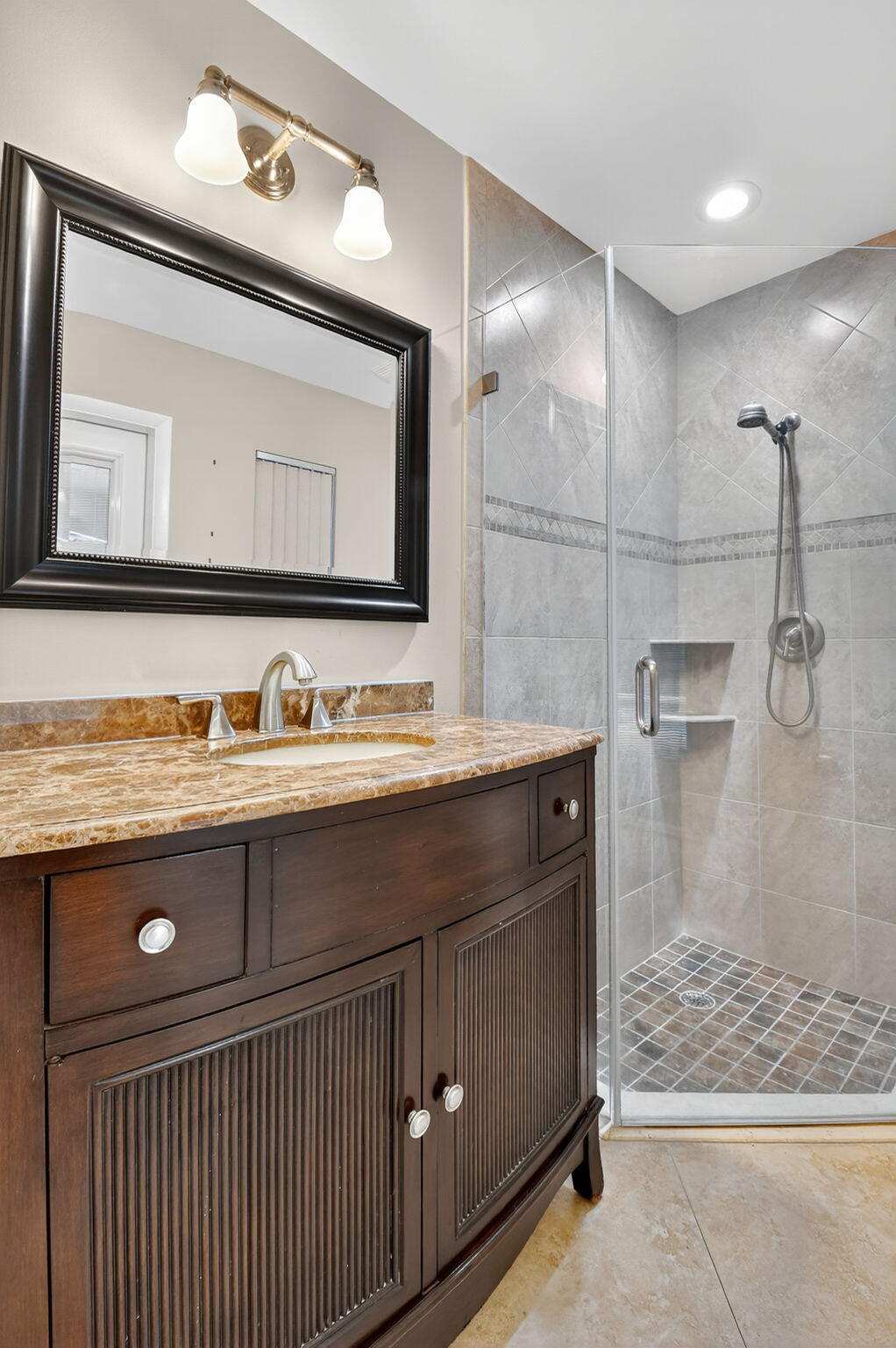 360 Northwest 53rd Street Boca Raton, FL 33487 - Photo 32 of 72 a bathroom with a sink a vanity and a mirror