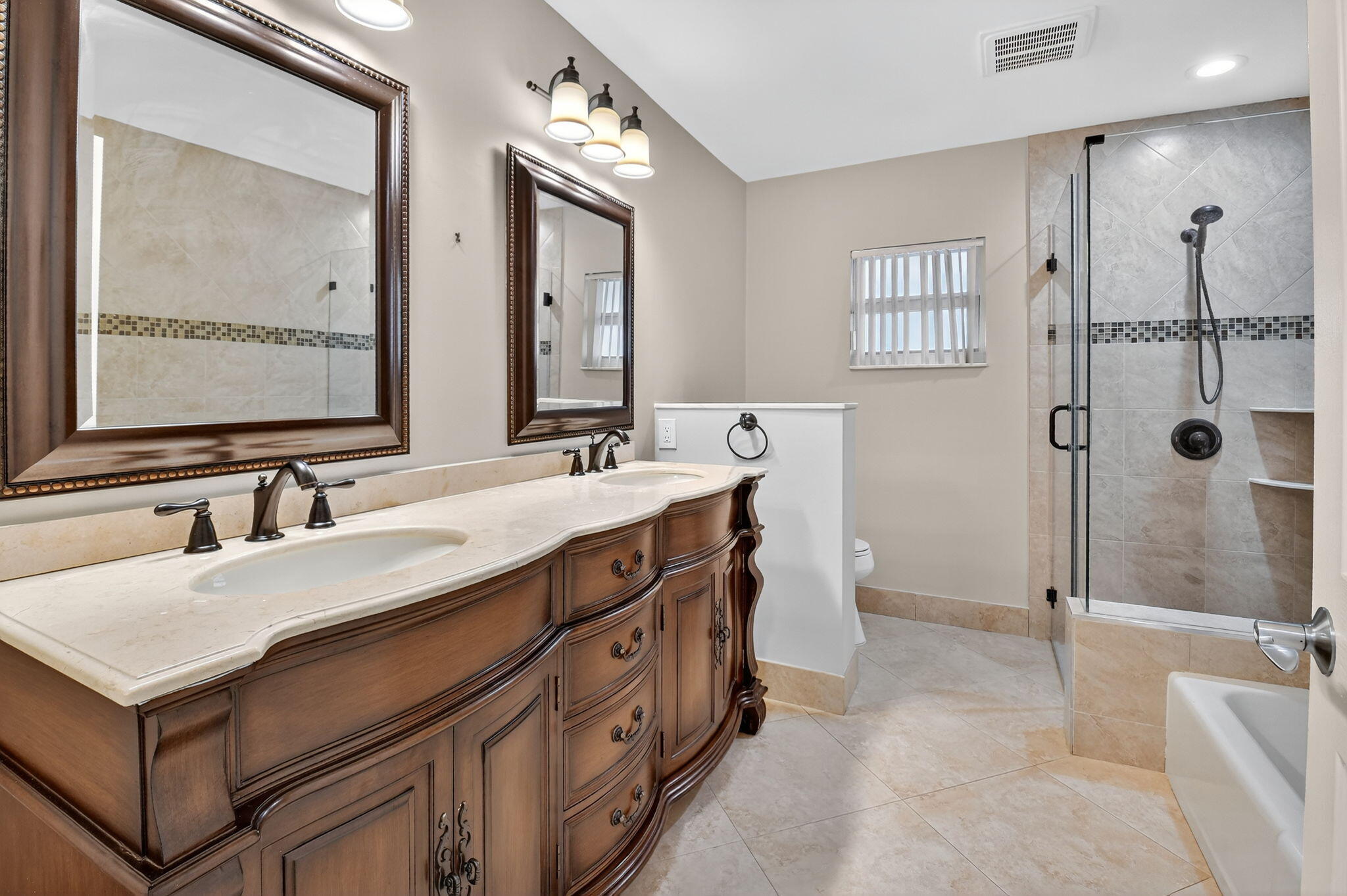 360 Northwest 53rd Street Boca Raton, FL 33487 - Photo 44 of 72 a bathroom with a double vanity sink mirror and shower