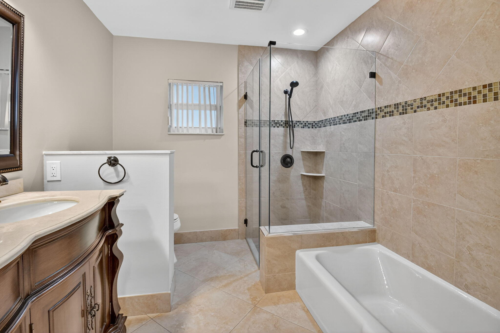 360 Northwest 53rd Street Boca Raton, FL 33487 - Photo 45 of 72 a bathroom with a tub a sink and a shower