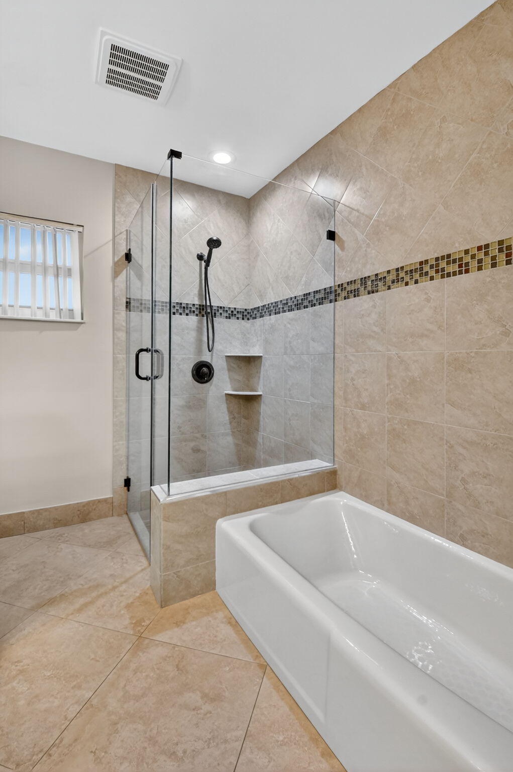 360 Northwest 53rd Street Boca Raton, FL 33487 - Photo 46 of 72 a bathroom with a bathtub and a shower