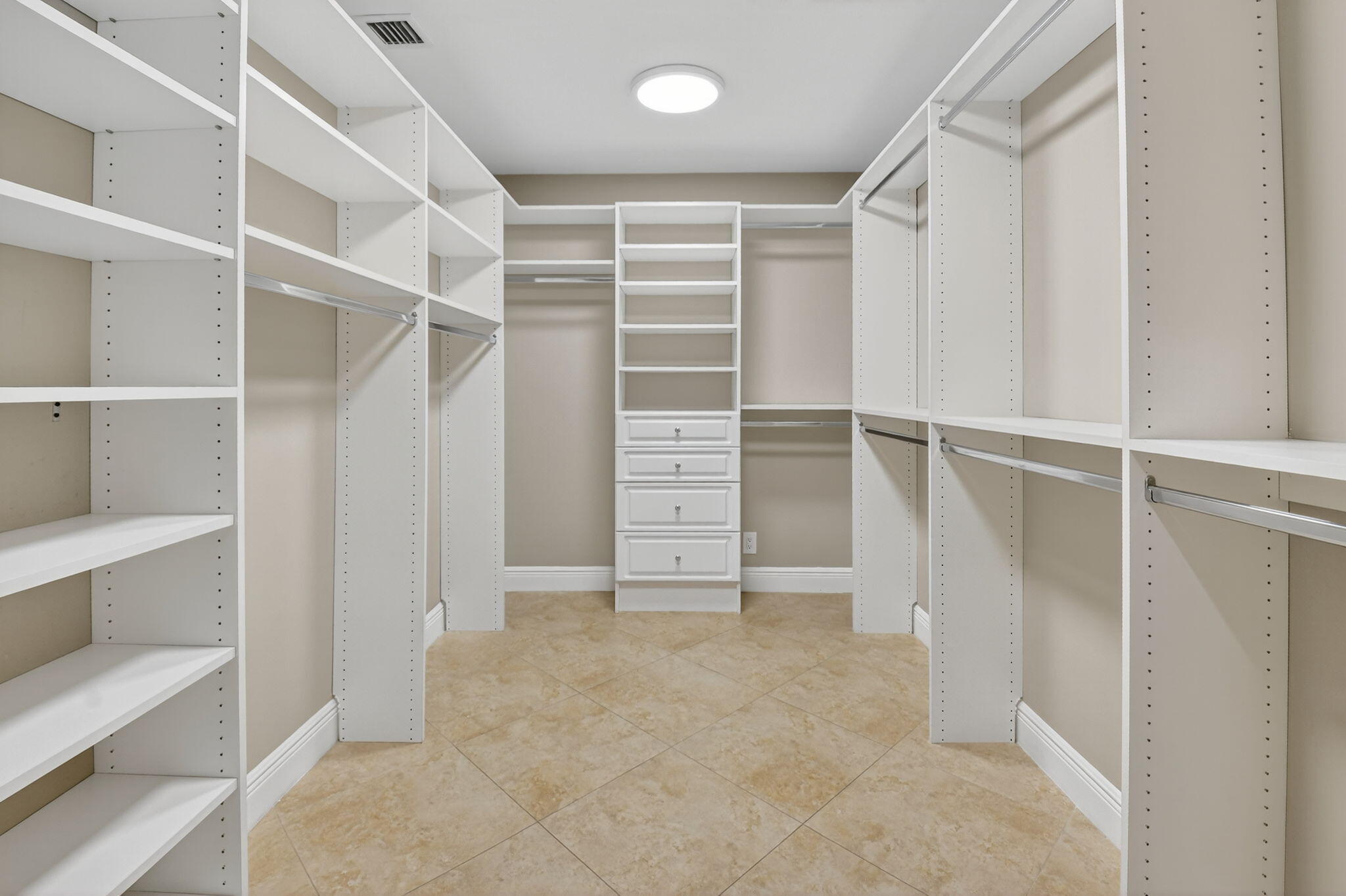 360 Northwest 53rd Street Boca Raton, FL 33487 - Photo 49 of 72 a view of walk in closet with empty racks