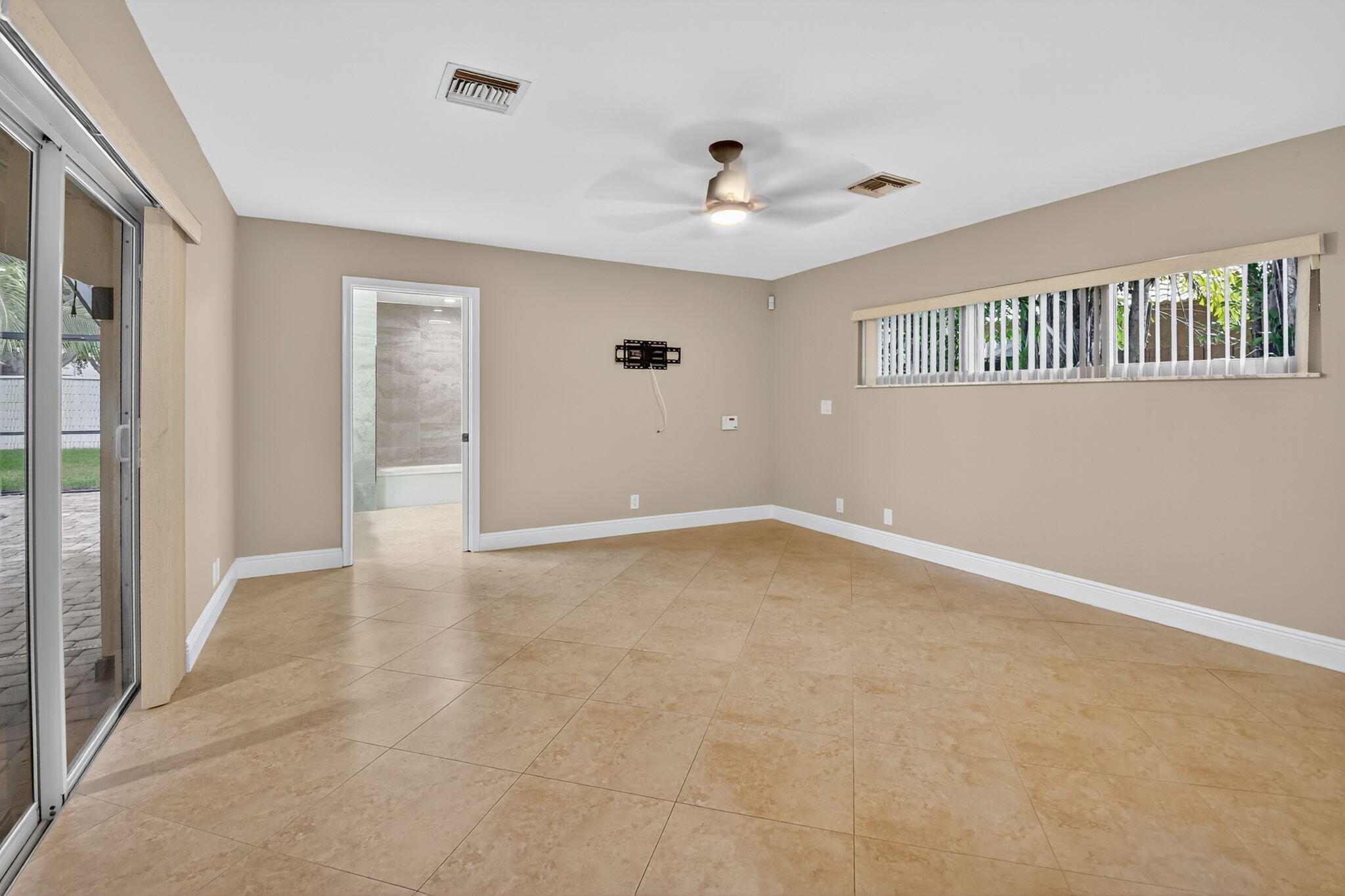 360 Northwest 53rd Street Boca Raton, FL 33487 - Photo 50 of 72 a view of an empty room with a window