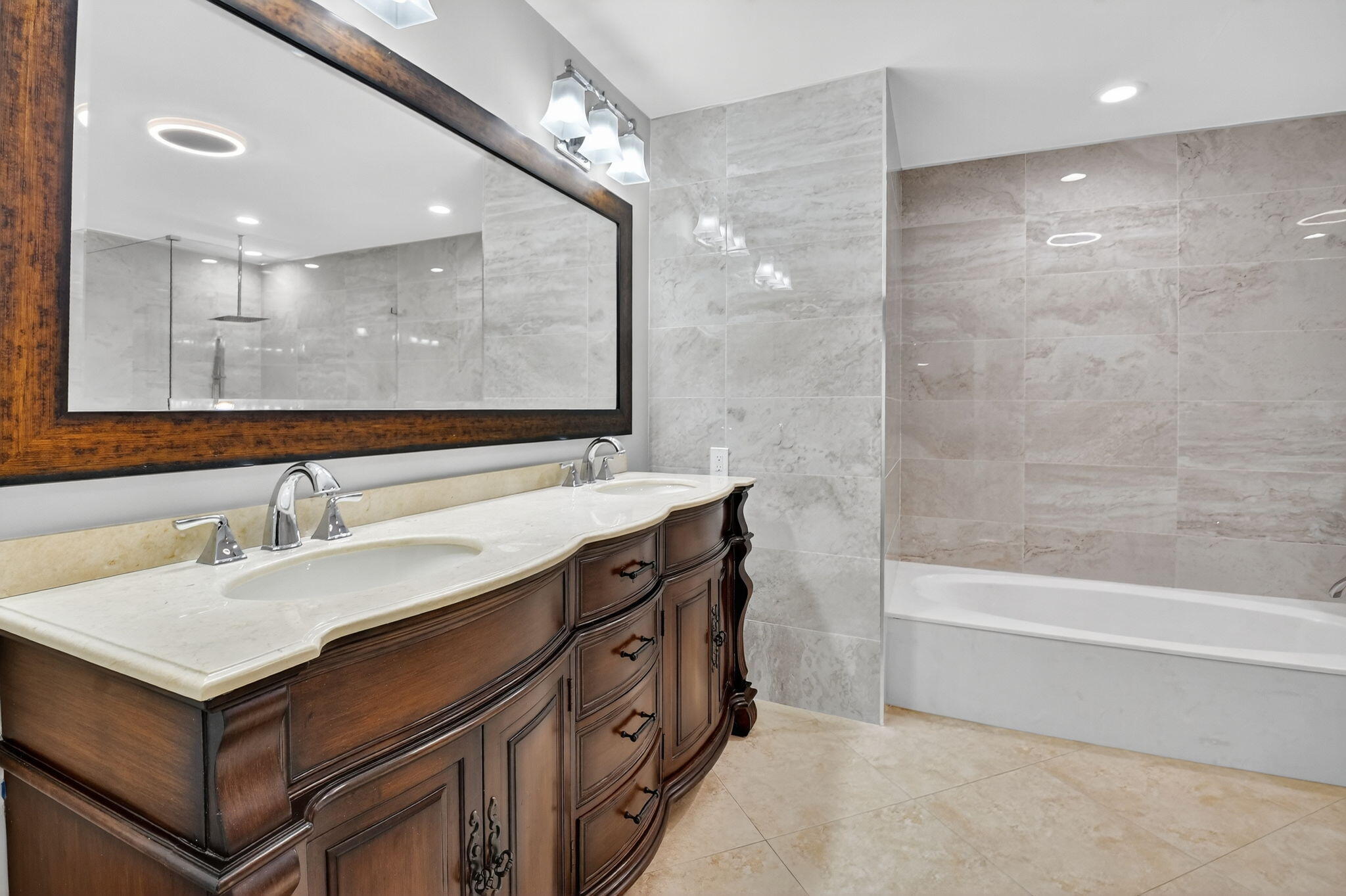 360 Northwest 53rd Street Boca Raton, FL 33487 - Photo 53 of 72 a bathroom with a sink double vanity and a bathtub
