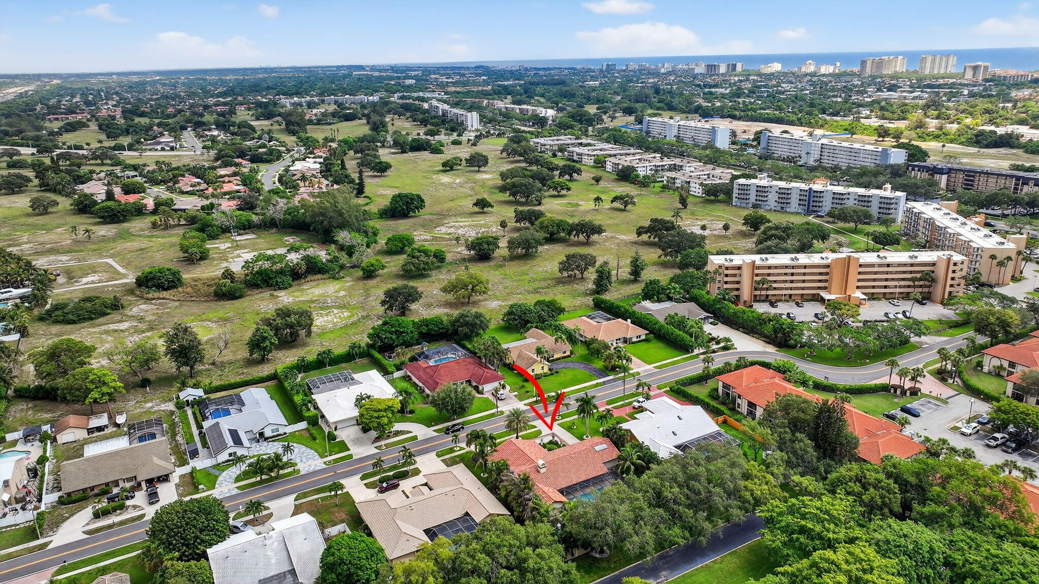 360 Northwest 53rd Street Boca Raton, FL 33487 - Photo 66 of 72 an aerial view of residential houses with outdoor space and parking