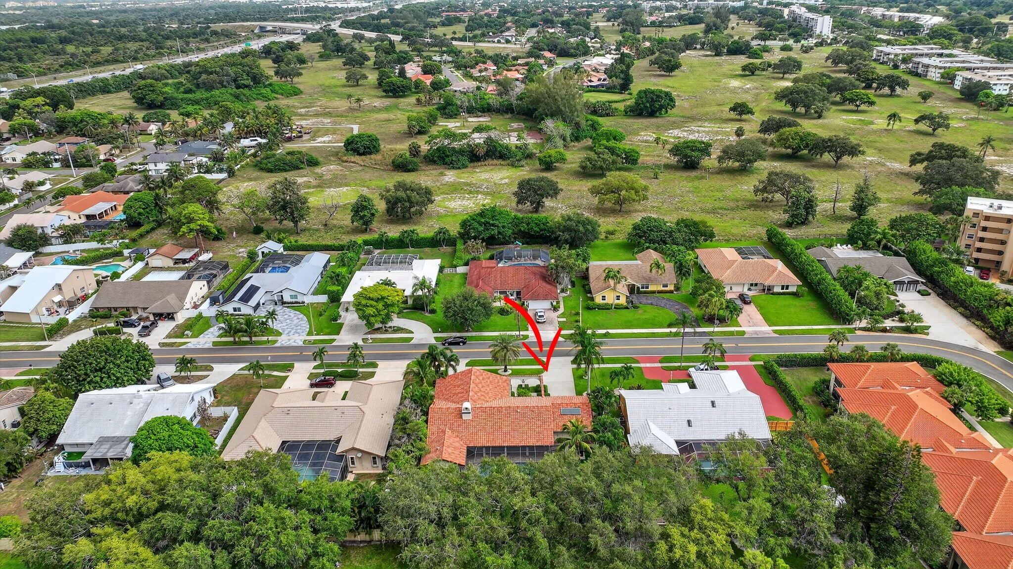 360 Northwest 53rd Street Boca Raton, FL 33487 - Photo 67 of 72 an aerial view of residential houses with outdoor space and parking