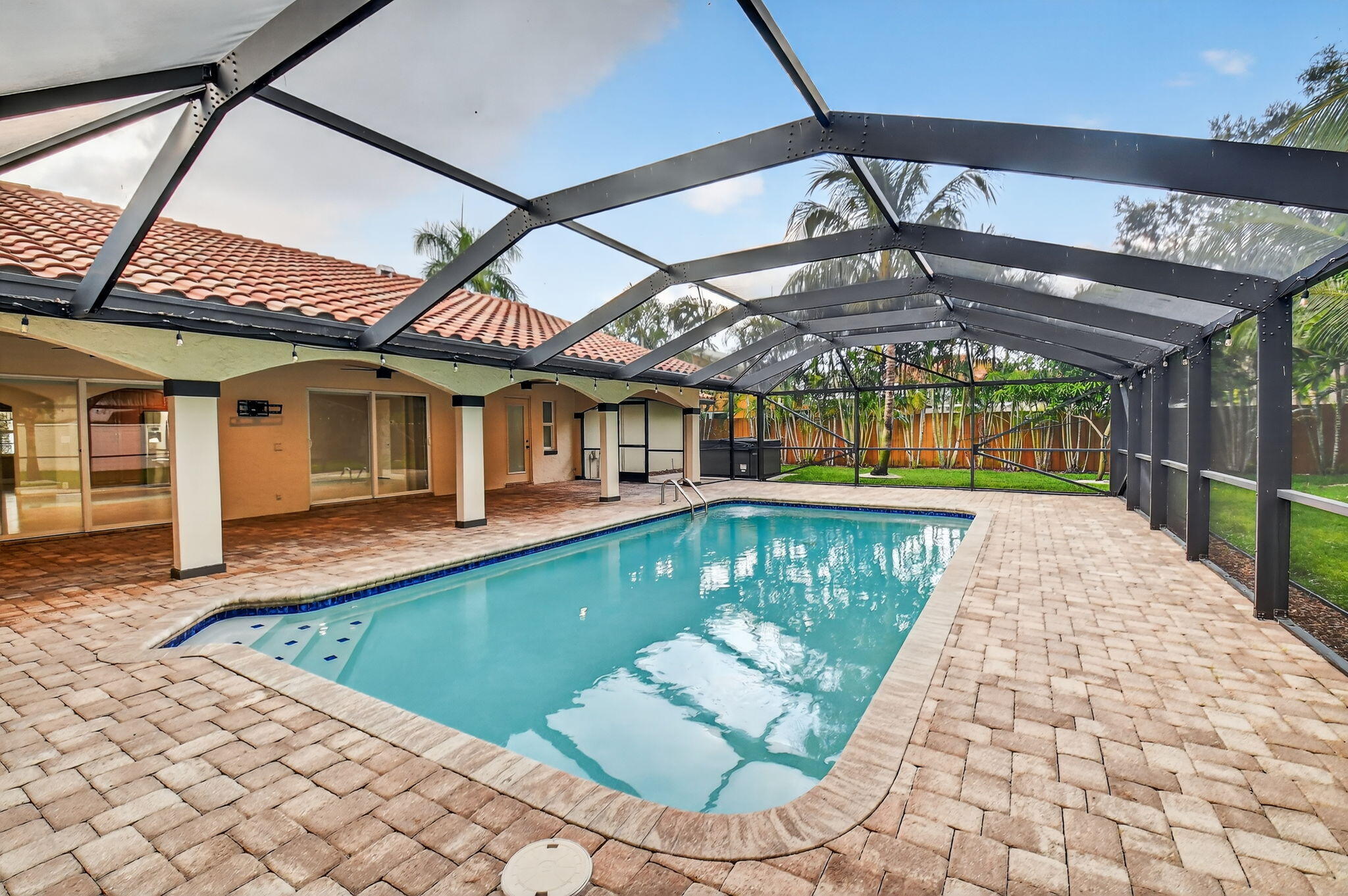 360 Northwest 53rd Street Boca Raton, FL 33487 - Photo 8 of 72 a view of a house with a swimming pool