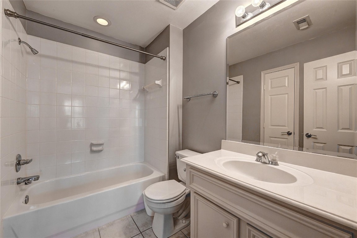 1012 Rochow Street Houston, TX 77019 - Photo 11 of 16 a bathroom with a granite countertop sink toilet and shower