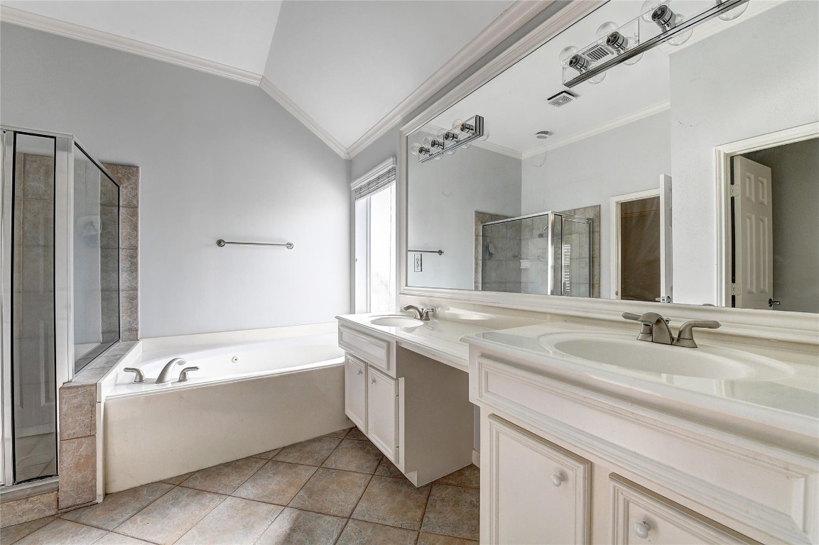 1012 Rochow Street Houston, TX 77019 - Photo 14 of 16 a bathroom with a granite countertop bathtub a sink and a mirror
