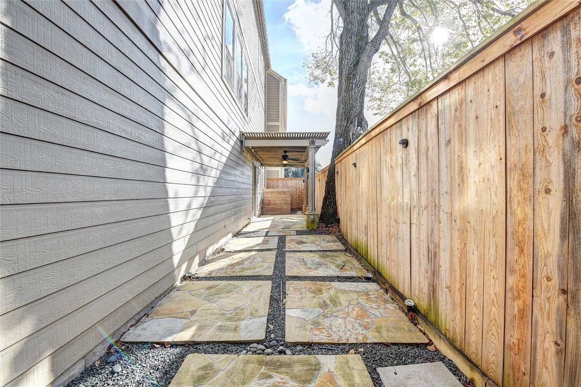 1012 Rochow Street Houston, TX 77019 - Photo 16 of 16 a view of a balcony with wooden floor and staircase
