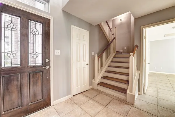a view of a livingroom with stairs