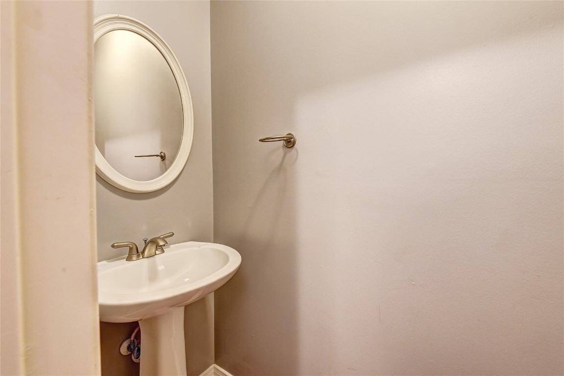 1012 Rochow Street Houston, TX 77019 - Photo 7 of 16 a bathroom with a sink and a mirror