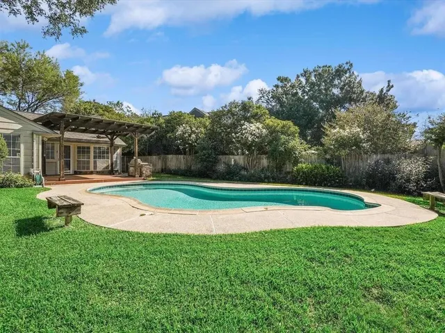 a view of a house with a swimming pool