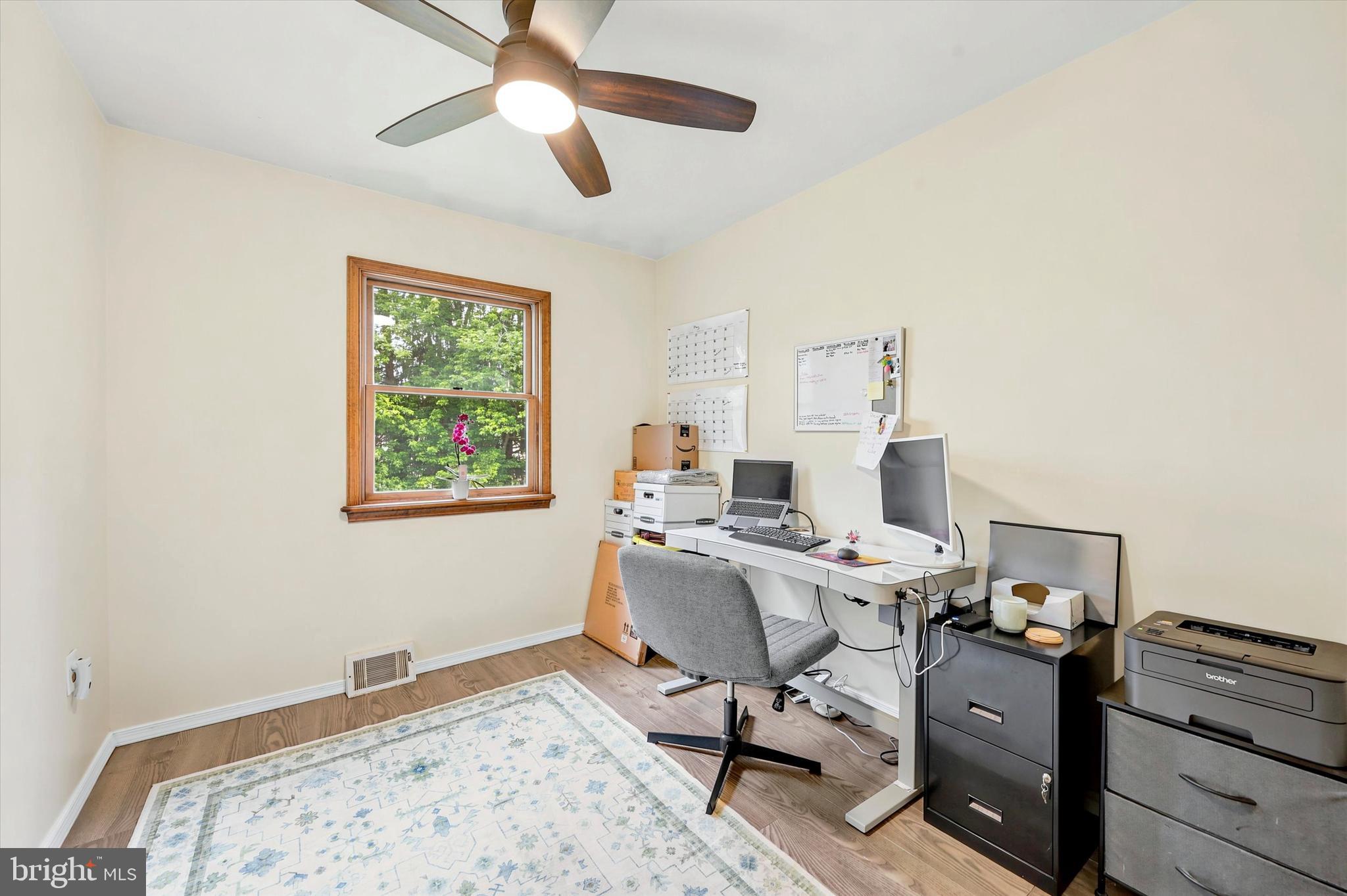 319 Willowbrook Road Upper Chichester, PA 19061 - Photo 9 of 24 a view of a workspace with furniture and a window