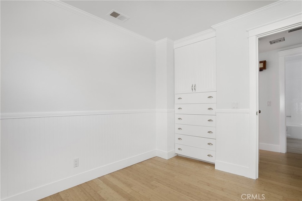 20006 Shamrock, Unit 10 Lake Forest, CA 92630 - Photo 17 of 25 wooden floor in white cabinet