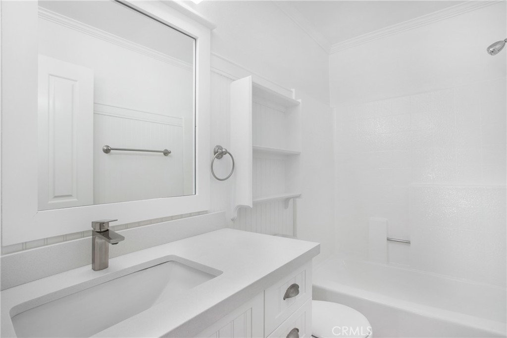 20006 Shamrock, Unit 10 Lake Forest, CA 92630 - Photo 18 of 25 a bathroom with a sink toilet vanity and tub