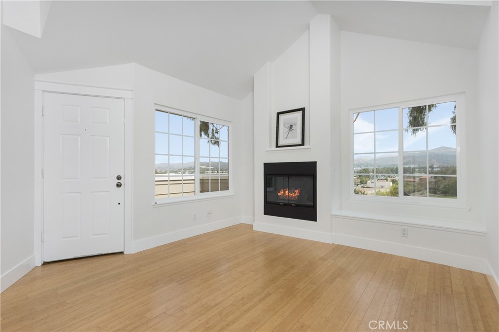 20006 Shamrock, Unit 10 Lake Forest, CA 92630 - Photo 3 of 25 an empty room with windows and fireplace