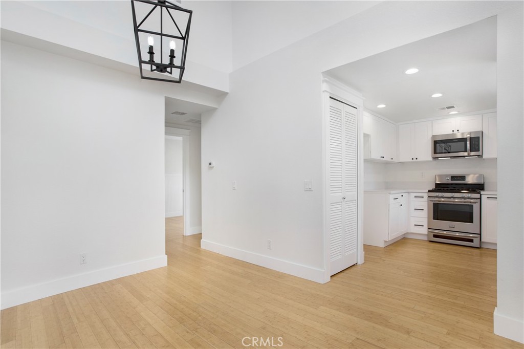 20006 Shamrock, Unit 10 Lake Forest, CA 92630 - Photo 7 of 25 a view of kitchen with wooden floor and electronic appliances