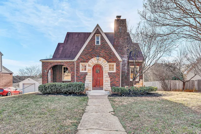 a front view of a house with yard