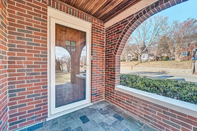 a view of a door and a window