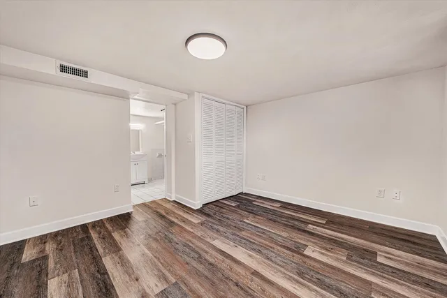 a view of room with wooden floor
