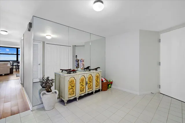 a spacious bedroom with a bed and a view of bathroom