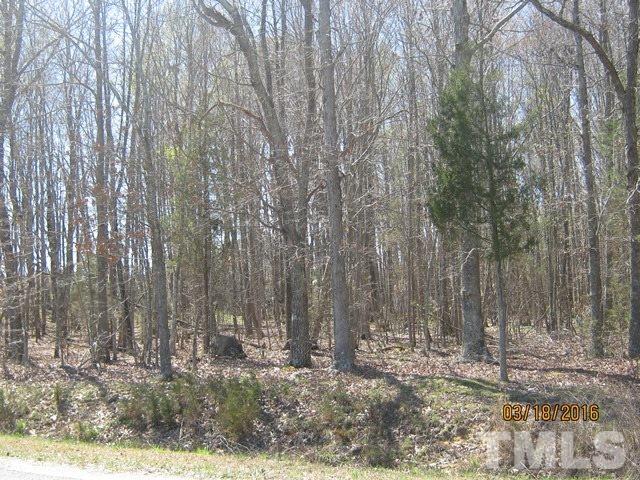 0 Hugh Blalock Road Roxboro, NC 27574 - Photo 15 of 17 a view of a yard with trees in the background