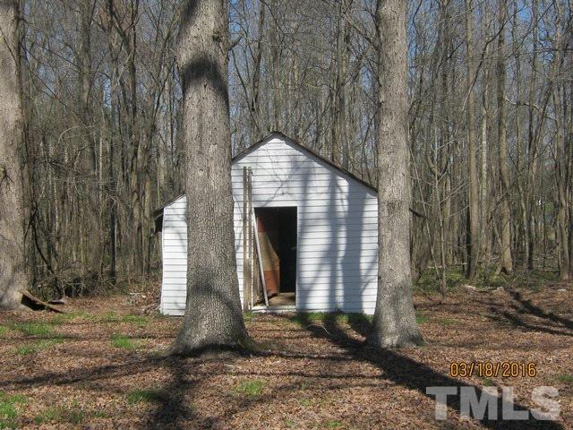 0 Hugh Blalock Road Roxboro, NC 27574 - Photo 3 of 17 a front view of a house with a yard