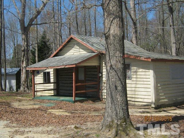 0 Hugh Blalock Road Roxboro, NC 27574 - Photo 6 of 17 a front view of a house with a yard