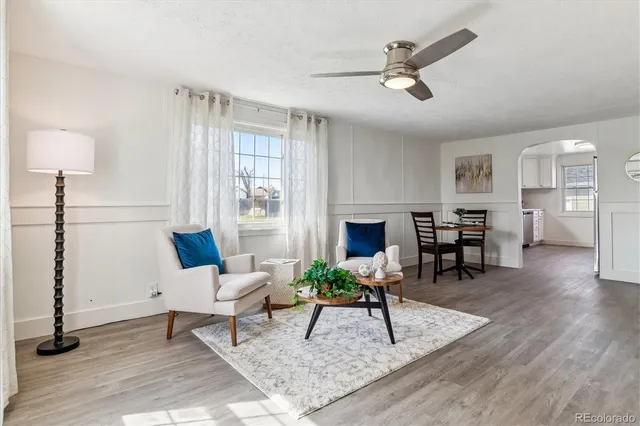 a living room with furniture a rug and a fireplace